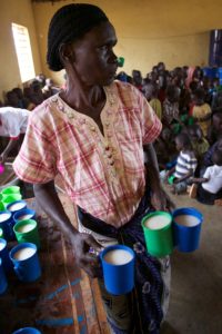 Agnes passing out porridge