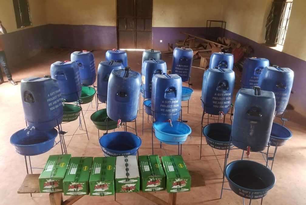 Installing hand-washing stations in the village of Musima